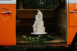 3-Tier Round Hand Painted Wedding Cake with Cascading Sugar Flowers and Gold Leaf Boarder | Retro Vintage Boho Wedding Inspiration with Orange VW Bus | Tampa Wedding Cake Bakery Hands on Sweets