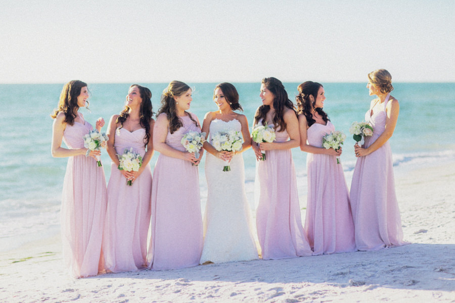 Outdoor Sarasota Bridal Party Wedding Portrait | Blush Pink Mismatched Bridesmaids Dresses with White Pronovias Wedding Dress with Ivory Bouquets