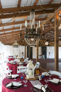 Outdoor Tampa Bay Barn Wedding Reception at Cross Creek Ranch with Merlot Tablecloths and Lantern Decor | Tampa Bay Wedding Photographer Carrie Wildes Photography