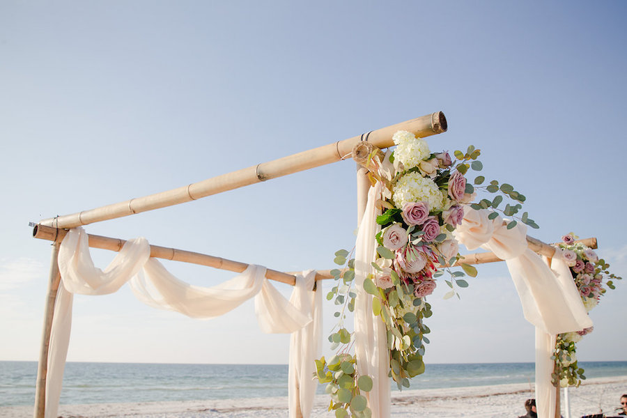 White and Blush Pink Dusty Rose Wedding Ceremony Floral Arrangement with White Ivory Hydrangeas with Greenery on Bamboo Wooden Altar with Draping | Clearwater Beach Wedding Planner Parties a la Carte