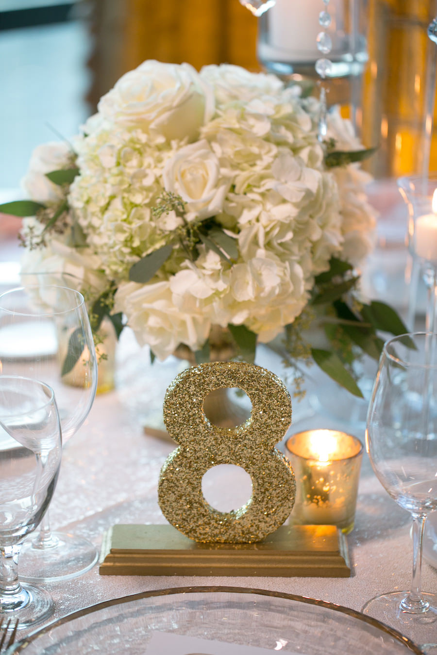 Short White Rose and Hydrangea Floral Wedding Centerpieces with Gold Glitter Table Numbers | Wedding Venue The Tampa Club | Tampa Wedding Photographer Carrie Wildes Photography | Tampa Wedding Florist Northside Florist