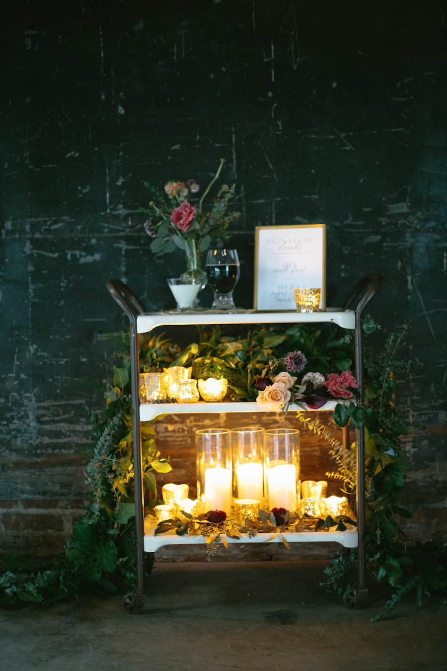 Candlelit Wedding Bar Cart with Greenery Decor and Roses | Modern Wedding Signature Drink Bar Cart with Menu | His and Her, Bride and Groom Signature Wedding Cocktails | Tampa Bay Wedding Planner Glitz Events