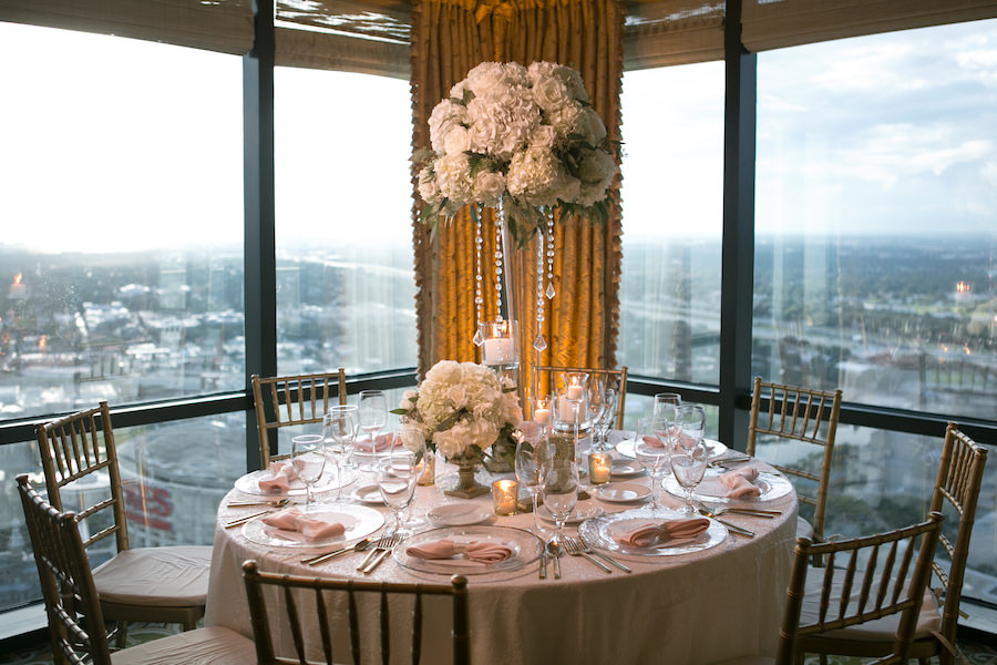 White and Gold Wedding Reception with Tall White Hydrangea Centerpieces and Gold Chiavari Chairs with White and Blush Linens | Rentals A Chair Affair | Linens by Gabro Event Services | Wedding Venue The Tampa Club | Tampa Wedding Photographer Carrie Wildes Photography | Tampa Wedding Florist Northside Florist