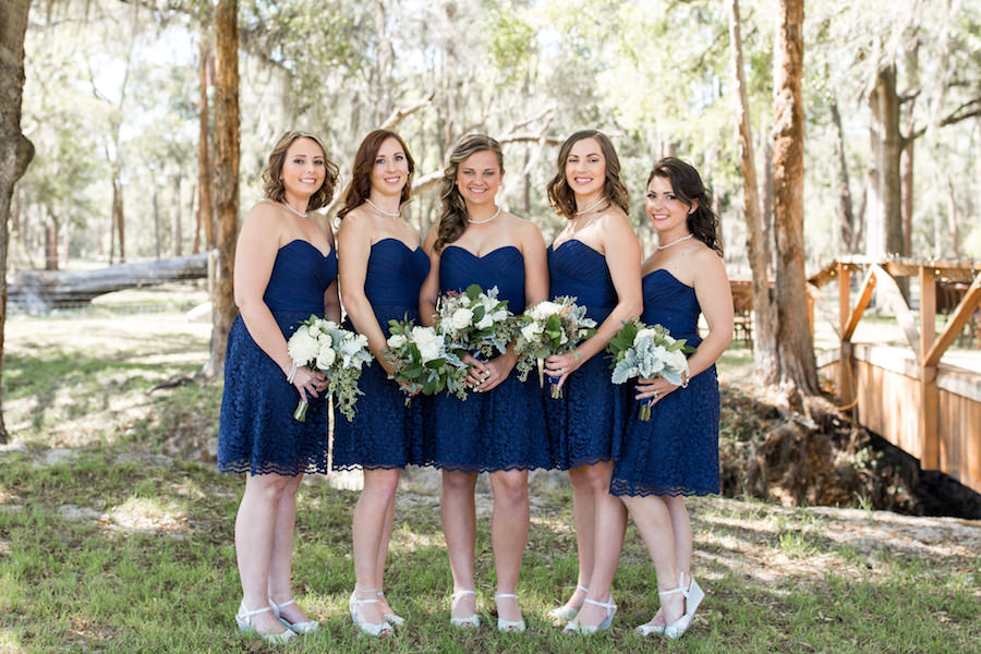 Bridesmaids Wedding Portrait in Strapless Navy, Short Lace Bridesmaids Dresses with Ivory and Greenery Bridal Bouquets