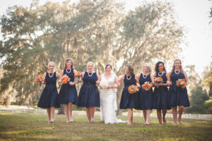 Navy Blue Bridesmaids Bridal Party Portrait with Bride | Short Navy Blue Bloomingdale's Bridesmaids Dresses with Pearls and Bright Bouquets | Dade CIty Wedding Venue The Lange Farm