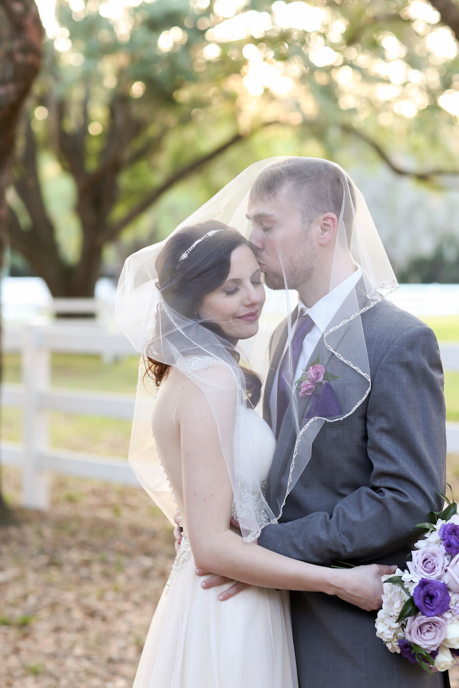 Bride and Groom Outdoor Wedding Portrait at Tampa Bay Wedding Venue The Lange Farm | Bride in Maggie Sottero Wedding Dress with Purple and Ivory Bouquet by Tampa Bay Wedding Florist Northside Florist