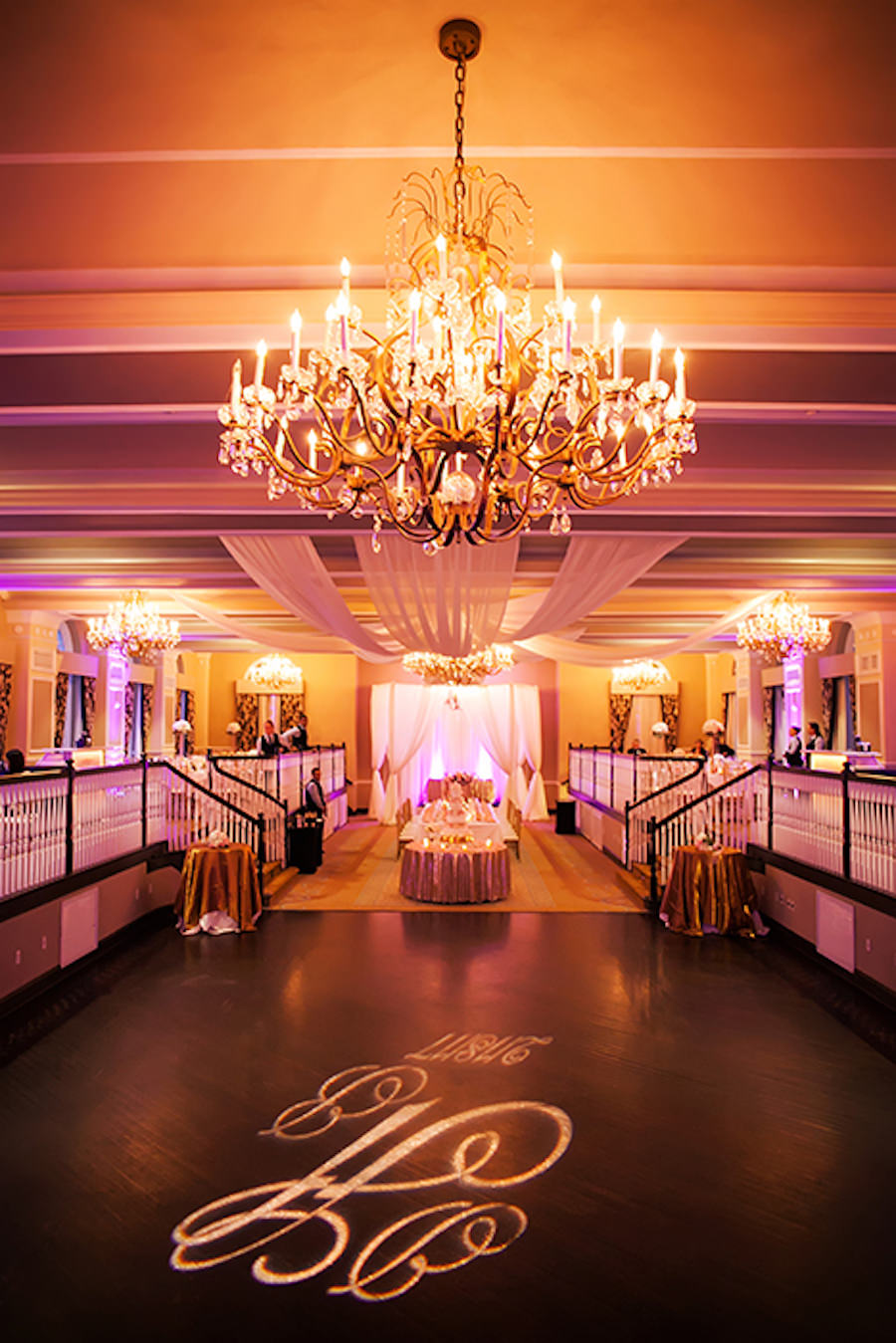 Classic Pink and Gold Wedding with Lighted Dance Floor Monogram under Intricate Chandelier at St Pete Beach Iconic Hotel Wedding Venue The Don Cesar | St Petersburg Wedding Photographer Limelight Photography