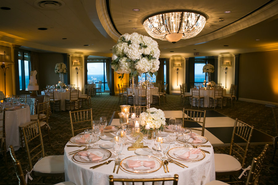 White and Gold Wedding Reception with Tall White Hydrangea Centerpieces and Gold Chiavari Chairs with White and Blush Linens | Rentals A Chair Affair | Linens by Gabro Event Services | Wedding Venue The Tampa Club | Tampa Wedding Photographer Carrie Wildes Photography | Tampa Wedding Florist Northside Florist