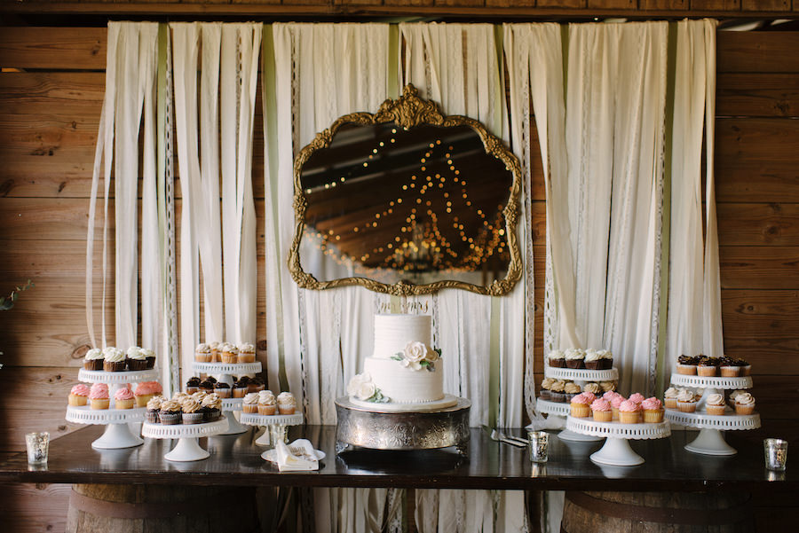 Rustic Ranch Wedding Dessert Table with Two Tier Round White Wedding Cake and Cupcakes by Tampa Bay Wedding Bakery Alessi Bakeries
