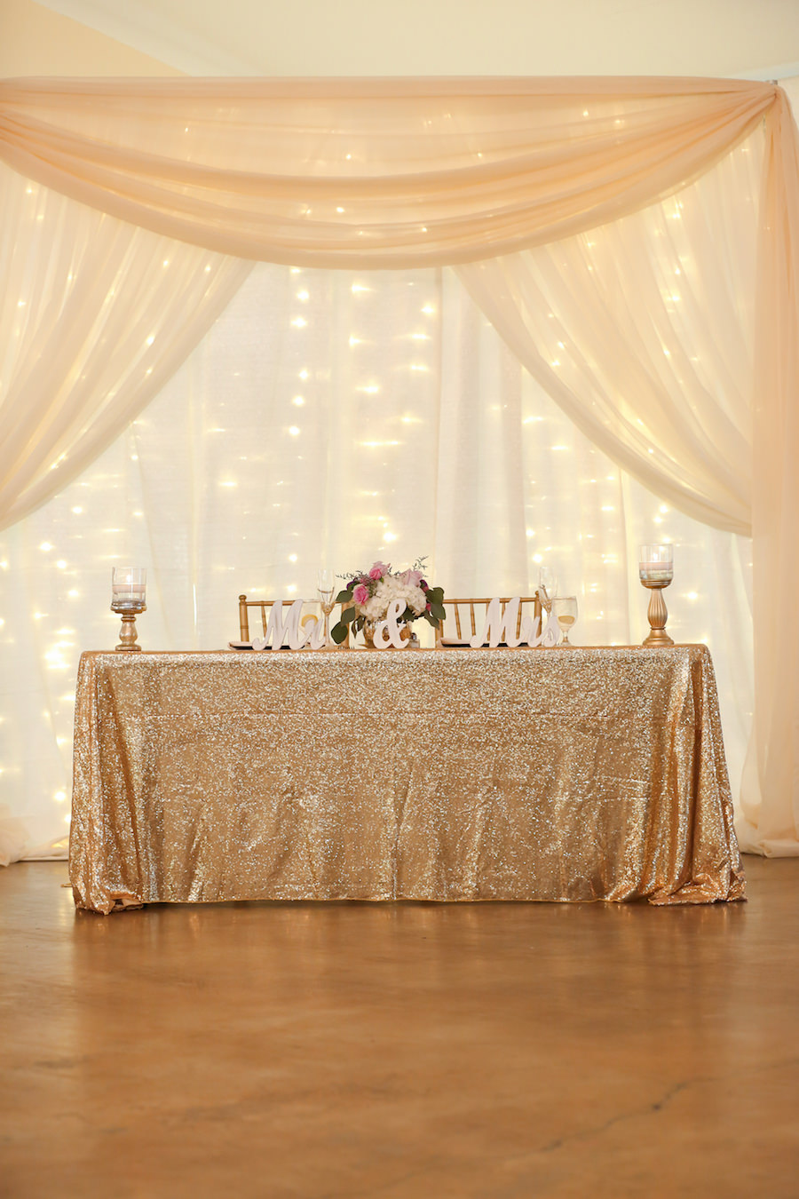 Sequin Gold Tablecloth on Wedding Sweetheart Table with Fabric Draping in Reception Room at Tampa Bay Wedding Venue The Lange Farm