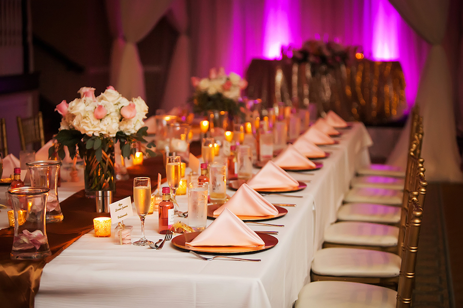 Elegant Wedding Feasting Tables with Ivory Linens and Light Pink and Ivory Floral Centerpieces with Gold Chiavari Chairs at St Petersburg Wedding Venue The Don Cesar | St Petersburg Wedding Photographer Limelight Photography