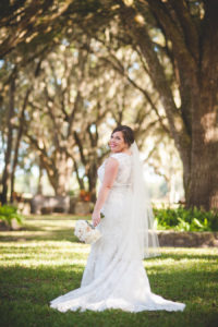 Outdoor Dade City Bride Wedding Portrait in Ivory, Lace Gown with Veil | Dade City Wedding Venue The Lange Farm