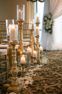 White and Gold Wedding Ceremony Decor and Inspiration with Gold Chiavari Chairs and Candles with White Rose Petals | Modern Elegant Downtown Tampa Wedding Venue The Tampa Club | Tampa Bay Florist Northside Florist | Rentals A Chair Affair