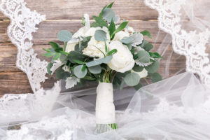 White Rose Bouquet with Greenery and Lace Wedding Veil