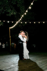 Bride and Groom First Dance at Night with Market Lighting | Outdoor Tampa Bay Wedding Venue