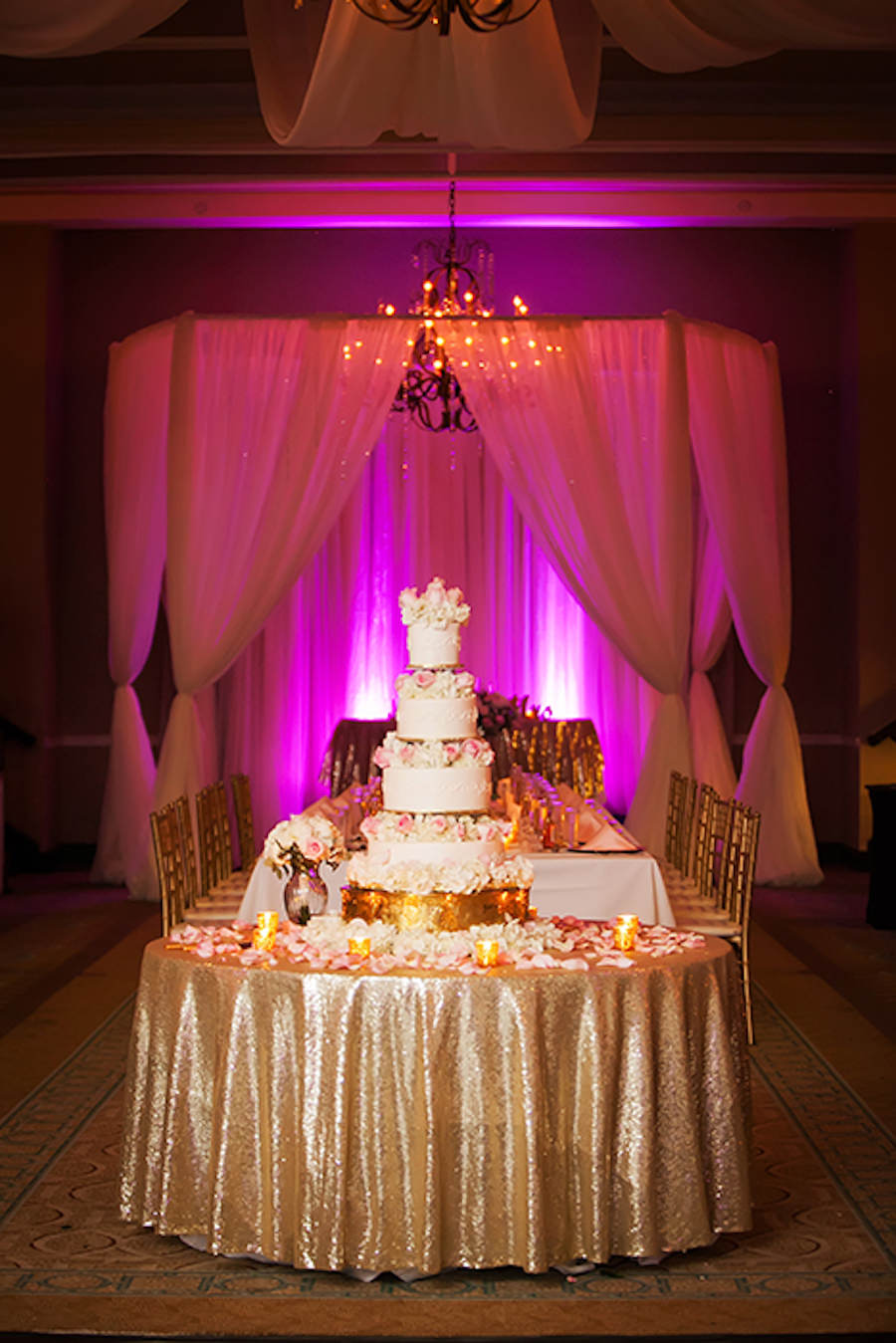 Four Tier Round Ivory Wedding Cake with Light Pink Roses on Gold Cake Stand and Gold Sparkly Specialty Linen | St Pete Wedding Photographer Limelight Photography