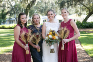 Outdoor Tampa Bay Bride and Bridal Party Wedding Portrait in Mikaella Bridal Dress with Veil and Mismatched Bridesmaids Dresses | Tampa Bay Wedding Photographer Carrie WIldes Photography | Cross Creek Ranch