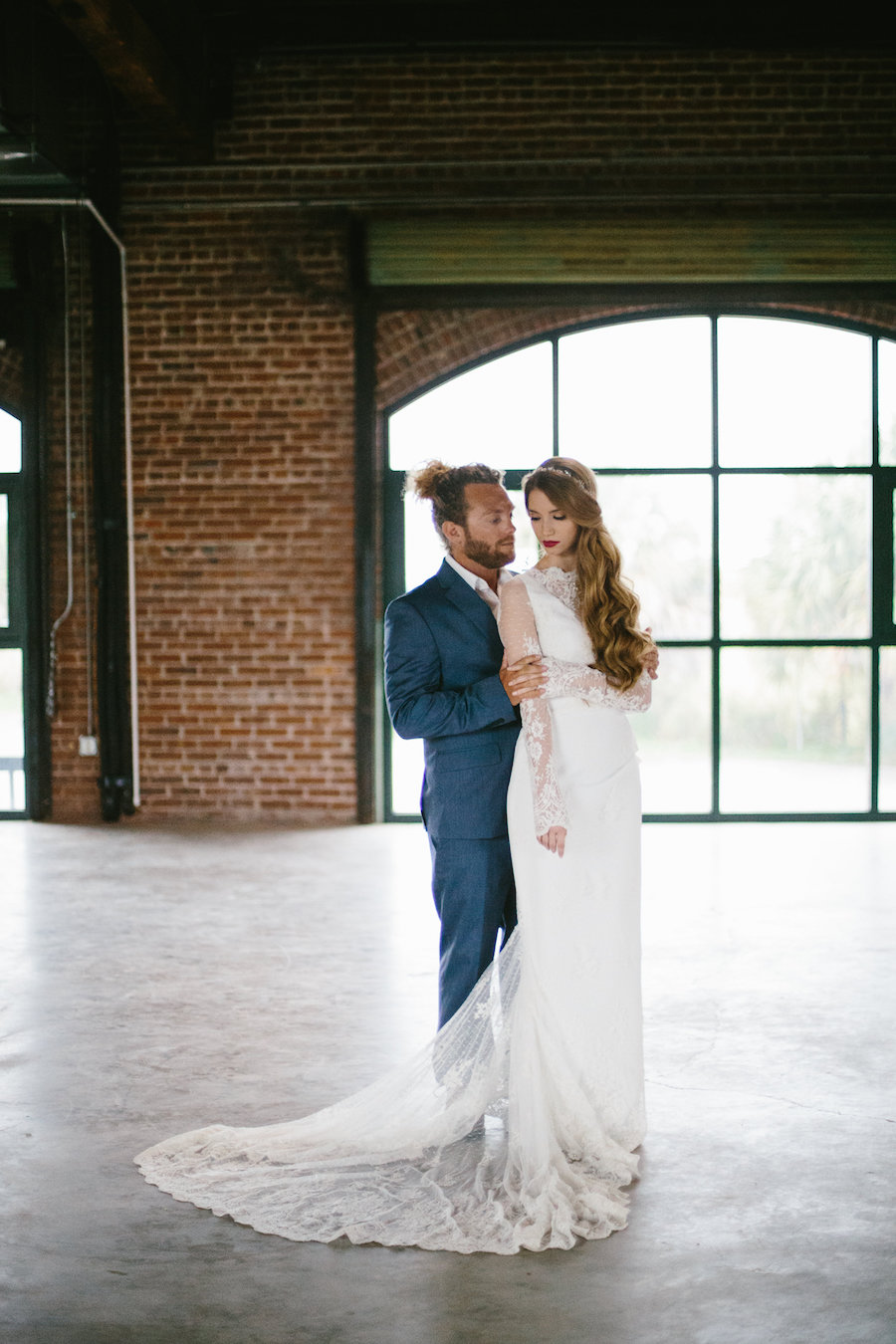 Modern Bohemian Inspired Wedding Styled Shoot Portrait of Bride in Long Sleeve Lace Isabel O'Neil Bridal Collection Wedding Gown and Groom in Grey Suit