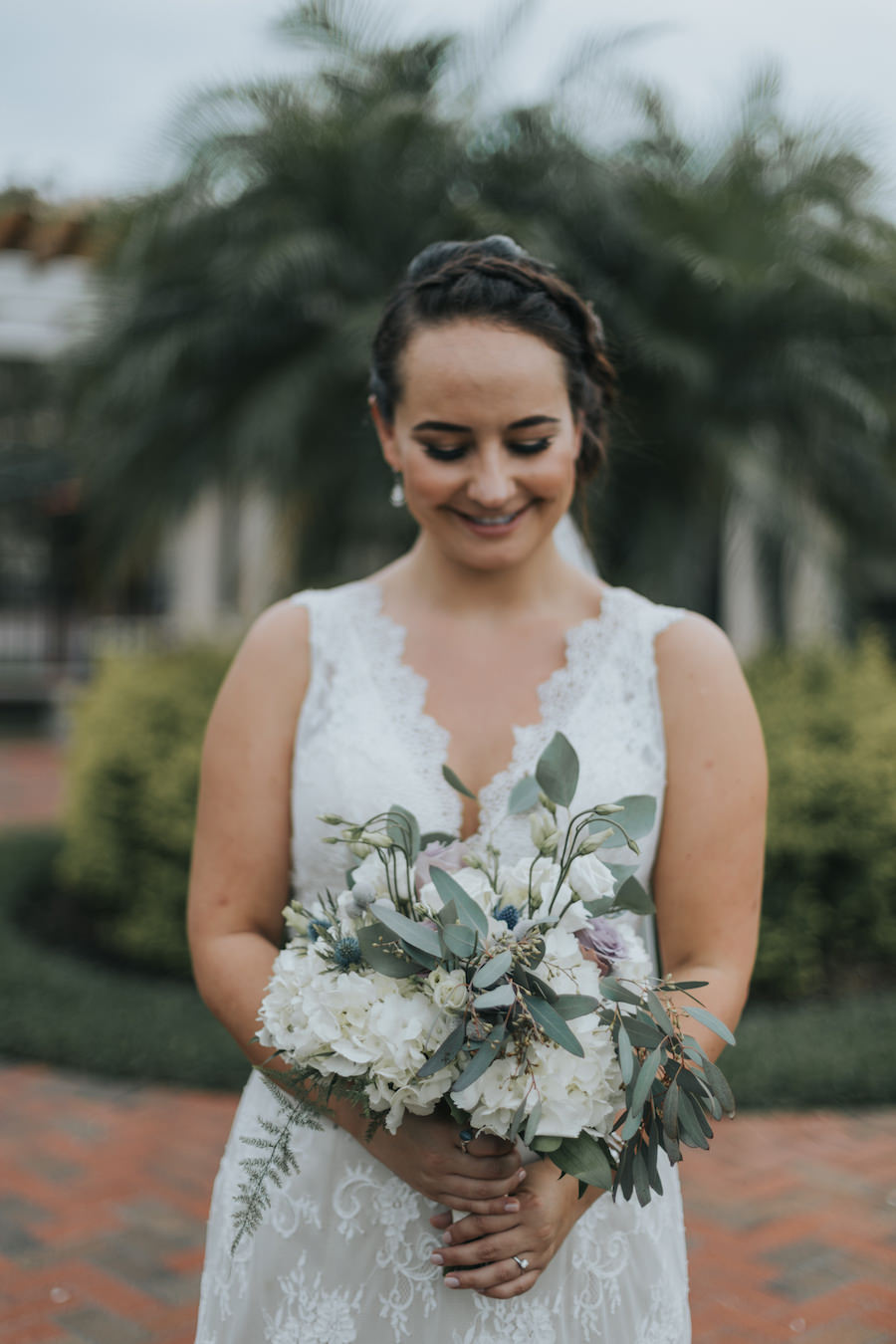 Bridal Wedding Portrait in Sleeveless Ivory Lace Wedding Dress with Ivory, Purple and Greenery Bridal Wedding Bouquet with Eucalyptus | Tampa Bay Wedding Florist Wonderland Floral Art