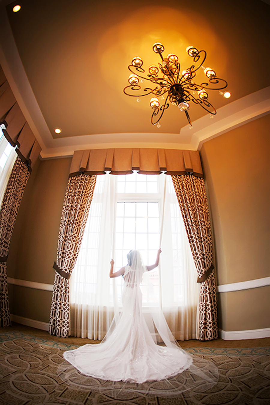 Bridal Wedding Day Portrait in Lace Backless Wedding Dress with Chapel Train and Cathedral Veil at St Petersburg Wedding Venue The Don Cesar | Wedding Photography by Limelight Photography