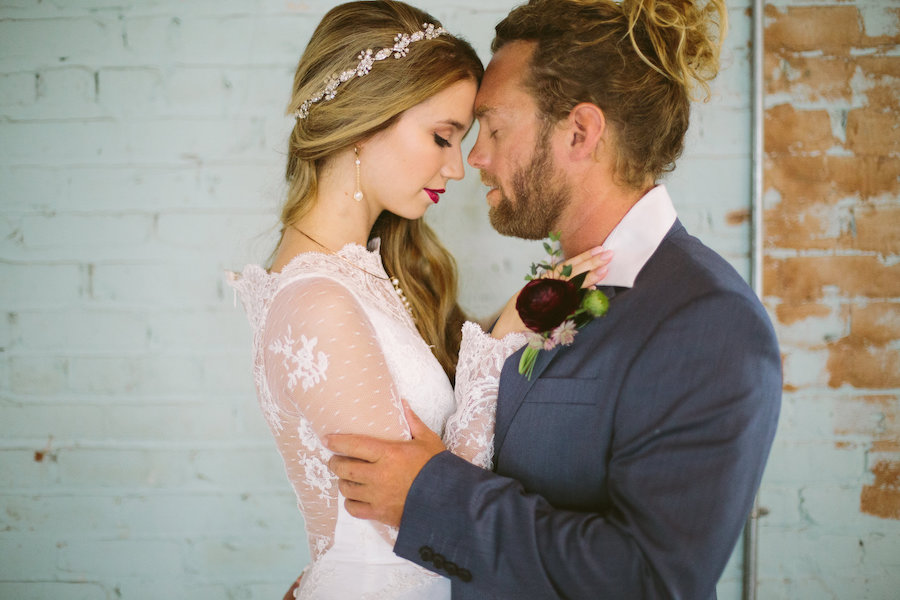 Modern Bohemian Inspired Wedding Styled Shoot Portrait of Bride in Long Sleeve Lace Isabel O'Neil Bridal Collection Wedding Gown and Groom in Grey Suit