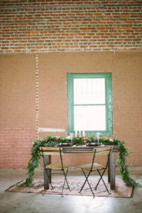 Florida, Modern Bohemian Inspired Styled Shoot | Vintaged Wooden Sweetheart Table with Folding Chairs and Greenery Garland Decor | Tampa Bay Wedding Planner Glitz Events