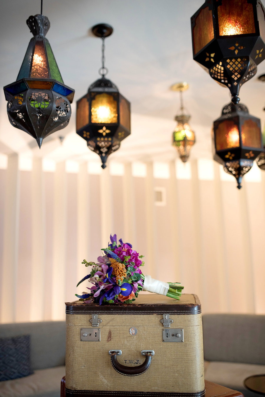 Vintage Suitcase and Hanging Lanterns with Tropical Pink and Orange Wedding Bouquet | St. Petersburg Wedding Florist Wonderland Floral Art | St. Pete Beach Photographer Kristin Marie Photography