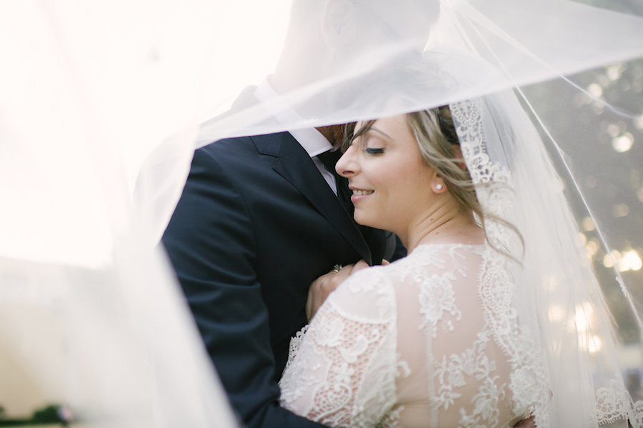 Bride and Groom Florida Wedding Portrait in Long Sleeve Lace Wedding Dress with Lace Veil
