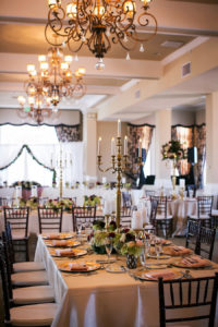 Don CeSar Hotel, St Pete Florida Wedding Reception with Feasting Tables and Brown Chiavari Chairs with Gold Candelabras | Limelight Photography