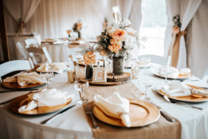 Outdoor, Florida Barn Wedding Reception with Burlap Table Runners and Gold Charger Plates with Peach Florals and Wooden Decor | Rustic Florida Wedding Venue Cross Creek Ranch