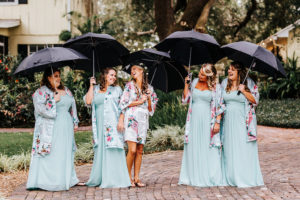 Bride and Bridesmaid Fun Getting Ready Wedding Portrait with Umbrellas and Silk Robes | Light Blue David's Bridal Bridesmaids Dresses