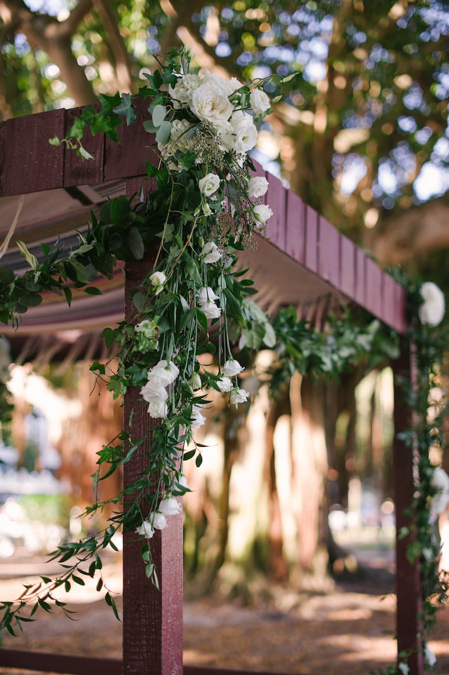 Outdoor Florida Jewish Wedding Ceremony Inspiration | Chuppah with Greenery and White Rose Floral Decor and Canopy