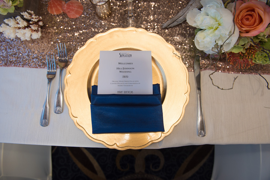 Nautical Inspired Wedding Reception with Gold Sequin Table Runner with Gold Charger Plates and Navy Napkins | Tampa Bay Waterfront Wedding Venue Yacht StarShip