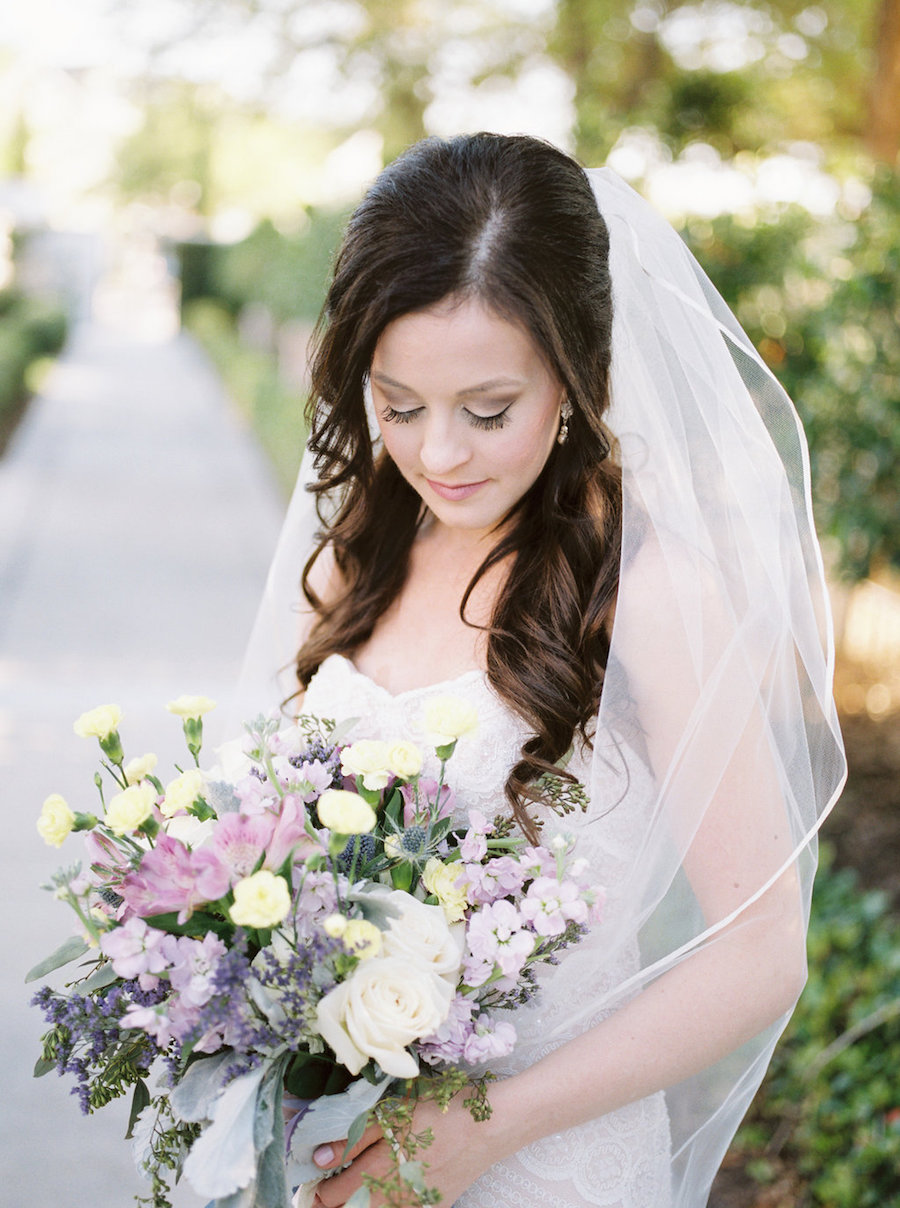 Outdoor Florida Bride Bridal Wedding Portrait in Strapless Wtoo Wedding Gown with Veil and Purple Ivory Yellow and Greenery Wedding Bouquet