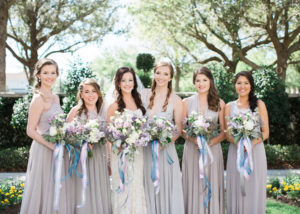 Outdoor Florida Bride and Bridal Party Wedding Portrait in Strapless Wtoo Wedding Gown with Veil and Purple Ivory Yellow and Greenery Wedding Bouquets