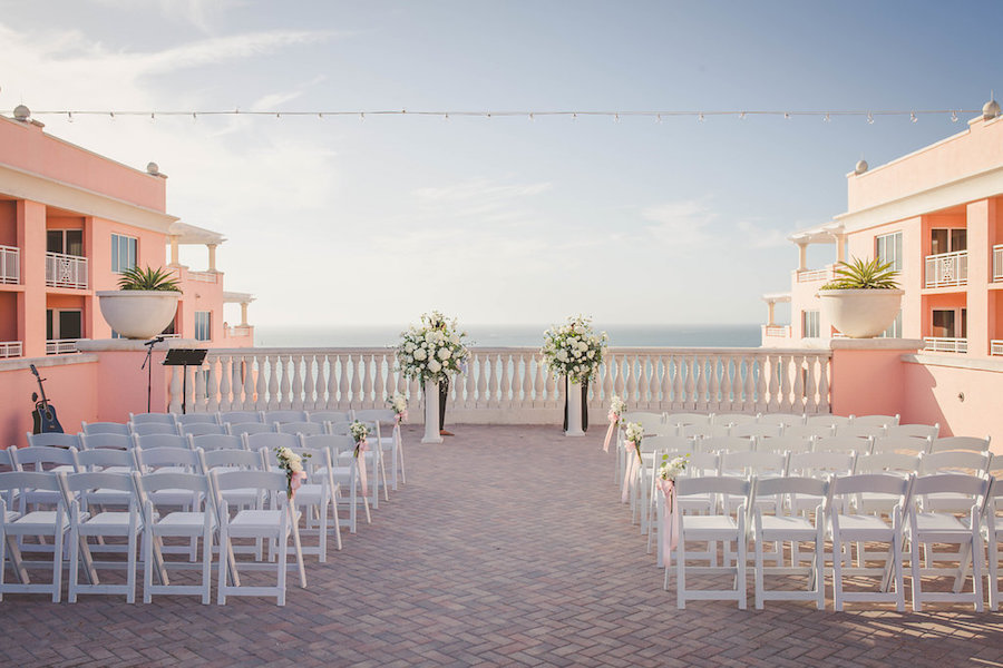 Rooftop Outdoor Hotel Wedding Ceremony Venue Hyatt Regency Clearwater Beach with White Folding Chairs Tall White Bouquets and Blush Ribbon