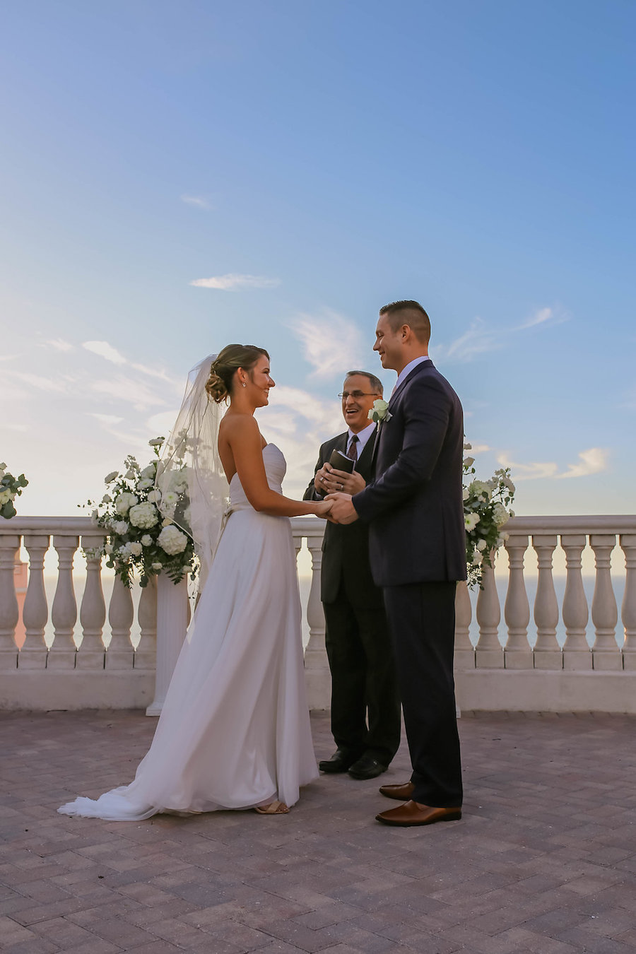 Rooftop Oceanside Wedding Ceremony Portrait with Large White Bouquets and Sweetheart Mikaella Dress at Tampa Bay Wedding Venue Hyatt Regency Clearwater