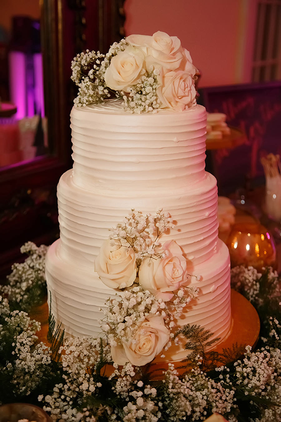 Three Tier Wedding Cake with White Roses, Baby's Breath and Greenery