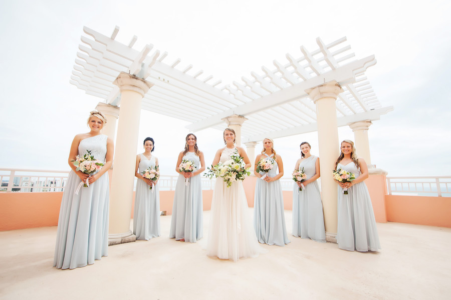 Outdoor Bridal Party Portrait with Light Blue Mismatched Azazie Bridesmaids Dresses and Watters Wedding Dress and White, Pink, Peach, and Yellow Bouquets with Greenery | Hotel Wedding Venue Hyatt Regency Clearwater Resort | Tampa Bay Photographer Limelight Photography