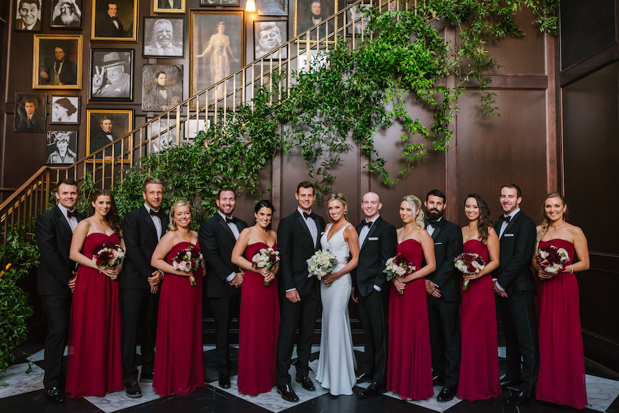 Elegant Rustic Great Gatsby Inspired Wedding Party Portrait with White Blush and Dark Red Bouquets, Martina Liana wedding Dress, and Bordeaux Bridesmaids Dresses | Tampa Bay Wedding Venue Oxford Exchange