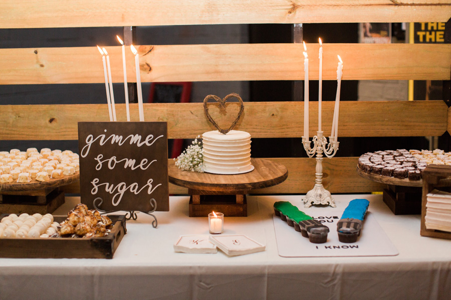 Industrial Rustic Wedding Dessert Table with Tall Antique Candelabras Handpainted Wood Sign and Star Wars Elements