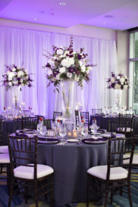 Tall Purple and White Wedding Centerpieces in Glass Vases with Dark Mahogany Chiavari Chairs | Elegant Wedding Reception Decor Ideas & Inspiration |  Signature Event Rentals, Gabro Event Services, Connie Duglin Linens