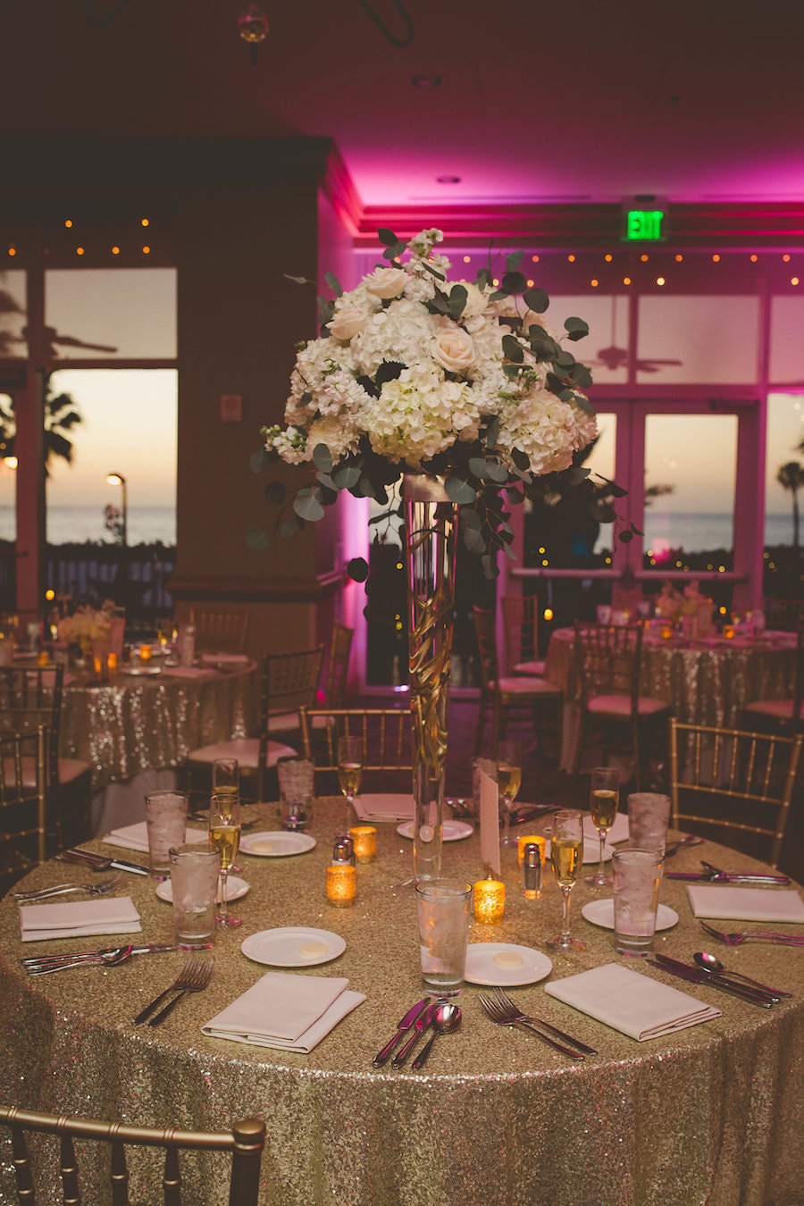 Timeless Gold and Blush Wedding Reception with Tall Glamorous White Hydrangea Centerpiece and Gold Table Linens and Chiavari Chairs | Tampa Bay Wedding Venue Hyatt Regency Clearwater Resort & Spa