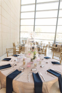 Modern Elegant Reception Table Decor with White Floral Centerpieces and Greenery, Blush Linens and Navy Blue Napkins, Silver Mercury Votive Candle Holders and Gold Chiavari Chairs