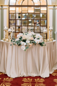 Elegant and Romantic Gold Blush and Ivory Wedding Reception Table Decor with Rose and Greenery Centerpiece and Tall Gold Candle Holders and Blush Linen