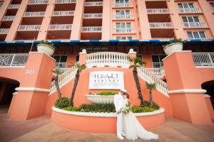 Outdoor Bride and Groom Portrait for Navy Military Wedding with White Floral and Greenery Bouquet | Wedding Hotel Venue Hyatt Regency Clearwater Resort | Tampa Bay Photographer Limelight Photography