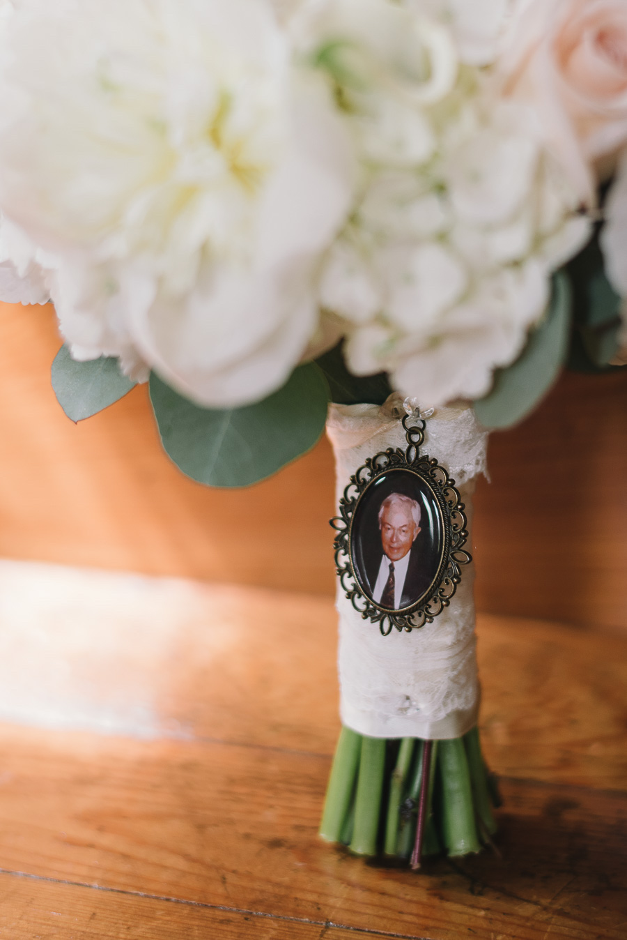 Bride Memory Locket on White Wedding Bouquet