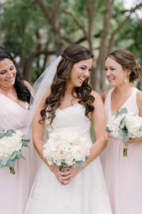 Outdoor Portrait of Bride in Watters Wedding Dress with Rose and Hydrangea Bouquet with Greenery and Blush Pink Mismatched Hayley Paige Bridesmaids Dresses