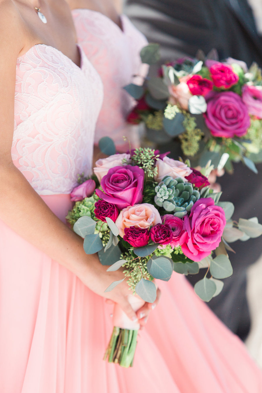 Bridesmaids in Sweetheart Blush Pink Dresses and Peach, Red, and Fuchsia Rose Bouquet with Greenery and Succulents