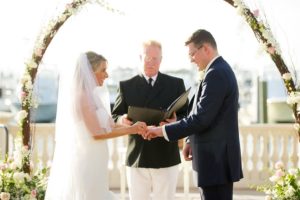 Outdoor Waterfront Wedding Ceremony with White and Pink Natural Branch Arch | Tampa Bay Wedding Venue Westshore Yacht Club | Photographer Andi Diamond Photography